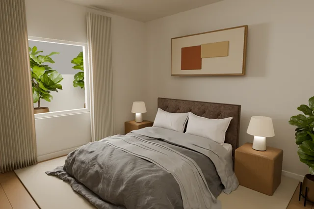 Master bedroom with warm lighting and a softly textured bed